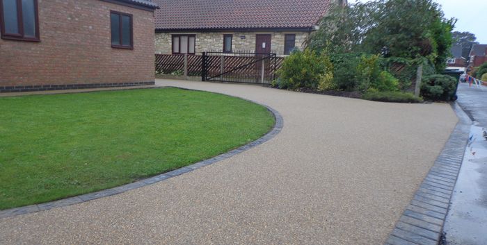 After image of large driveway with grass in Wakefield